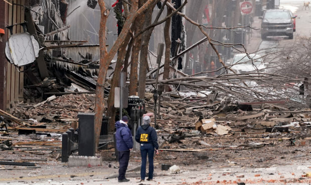Emergency personnel work near the scene of an explosion in downtown Nashville, Tenn., Friday, Dec. ...