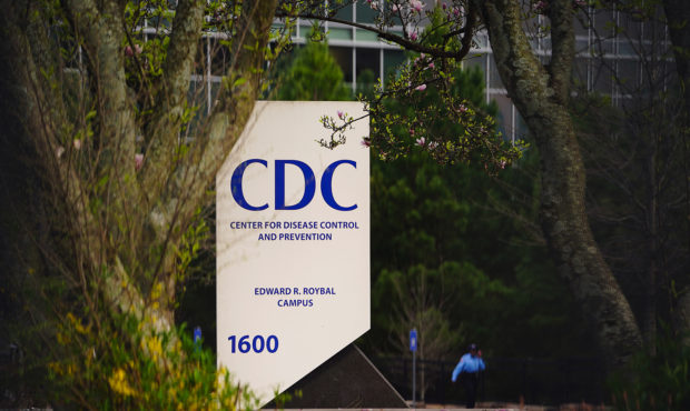 A security guard walks on the grounds of the Centers for Disease Control and Prevention (CDC) headq...