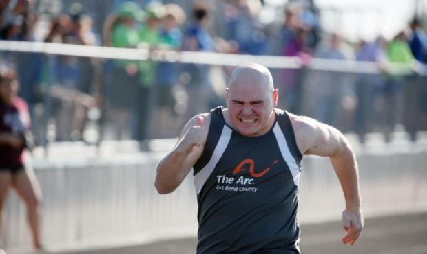 In this photo provided by Gary Schottle, Derek "Tank" Schottle competes in the 100 meter dash as pa...