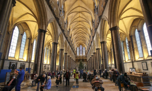 Members of the public receive the Pfizer-BioNTech coronavirus vaccine, at Salisbury Cathedral, in S...