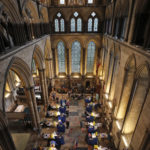 Fourteen tables are set up to provide the Pfizer-BioNTech vaccine inside Salisbury Cathedral in Salisbury, England, Wednesday, Jan. 20, 2021. Salisbury Cathedral opened its doors for the second time as a venue for the Sarum South Primary Care Network COVID-19 Local Vaccination Service. (AP Photo/Frank Augstein)