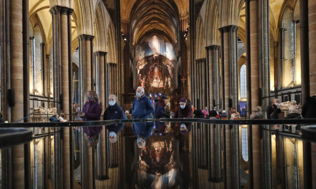 People are reflected in the 'Refection Pool' inside Salisbury Cathedral in Salisbury, England, Wedn...