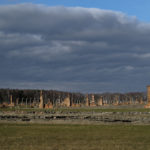 The remains of brick stone chimneys of prisoners barracks inside the former Nazi death camp of Auschwitz Birkenau or Auschwitz II. in Oswiecim, Poland, Sunday, Dec. 8, 2019. The commemorations for the victims of the Holocaust at the International Holocaust Remembrance Day, marking the liberation of Auschwitz-Birkenau on Jan. 27, 1945, will be mostly online in 2021 due to the coronavirus pandemic. (AP Photo/Markus Schreiber)