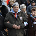 File - In this Sunday, Jan. 27, 2019 file photo, survivors of the Nazi death camp Auschwitz arrive for a commemoration ceremony on International Holocaust Remembrance Day at the International Monument to the Victims of Fascism inside Auschwitz-Birkenau in Oswiecim, Poland. Hundreds of Holocaust survivors in Austria and Slovakia are getting vaccinated against the coronavirus exactly 76 years after the liberation of the Nazi's Auschwitz death camp. More than 400 Austrian survivors were invited to get the vaccine at Vienna's biggest mass vaccination center on International Holocaust Remembrance Day on Wednesday Jan. 27, 2021. (AP Photo/Czarek Sokolowski)