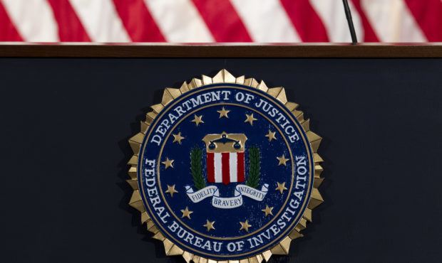 FILE - In this June 14, 2018, file photo, the FBI seal is seen before a news conference at FBI head...