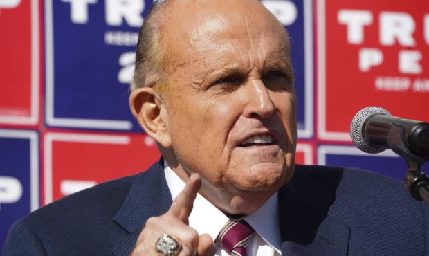 Attorney for the President, Rudy Giuliani, speaks at a news conference in the parking lot of a land...