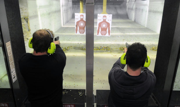 FILE -- Ross McGarvey, left, and David McWilliams practice their target shooting at the gun range a...