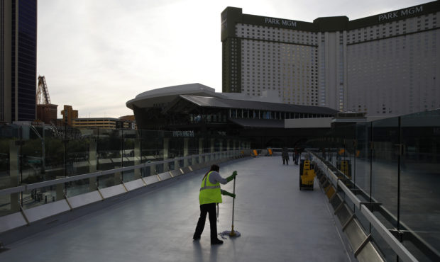 FILE - In this March 31, 2020, file photo, a worker cleans along the Las Vegas Strip devoid of the ...