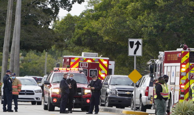 Law enforcement officers block an area where a shooting wounded several FBI while serving an arrest...
