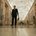 Gianni Crea, the Vatican Museums chief "Clavigero" key-keeper, holds a bunch of keys as he walks down the "Maps Aisle" to open the museum's rooms and sections, at the Vatican, Monday, Feb. 1, 2021. Crea is the “clavigero” of the Vatican Museums, the chief key-keeper whose job begins each morning at 5 a.m., opening the doors and turning on the lights through 7 kilometers of one of the world's greatest collections of art and antiquities. The Associated Press followed Crea on his rounds the first day the museum reopened to the public, joining him in the underground “bunker” where the 2,797 keys to the Vatican treasures are kept in wall safes overnight. (AP Photo/Andrew Medichini)