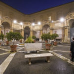 Gianni Crea, the Vatican Museums chief "Clavigero" key-keeper, walks through the octagonal courtyard on his way to open the museum's rooms and sections, the Vatican, Monday, Feb. 1, 2021. Crea is the “clavigero” of the Vatican Museums, the chief key-keeper whose job begins each morning at 5 a.m., opening the doors and turning on the lights through 7 kilometers of one of the world's greatest collections of art and antiquities. The Associated Press followed Crea on his rounds the first day the museum reopened to the public, joining him in the underground “bunker” where the 2,797 keys to the Vatican treasures are kept in wall safes overnight. (AP Photo/Andrew Medichini)