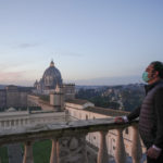 Gianni Crea, the Vatican Museums chief "Clavigero" key-keeper, poses for a photo on the "Nicchione" terrace on his way to open the museum's rooms and sections, the Vatican, Monday, Feb. 1, 2021. Crea is the “clavigero” of the Vatican Museums, the chief key-keeper whose job begins each morning at 5 a.m., opening the doors and turning on the lights through 7 kilometers of one of the world's greatest collections of art and antiquities. The Associated Press followed Crea on his rounds the first day the museum reopened to the public, joining him in the underground “bunker” where the 2,797 keys to the Vatican treasures are kept in wall safes overnight. (AP Photo/Andrew Medichini)