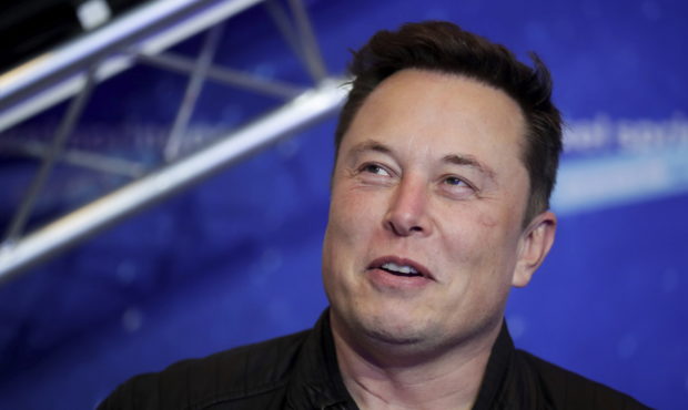FILE - In this Dec. 1, 2020, file photo, SpaceX owner and Tesla CEO Elon Musk arrives on the red ca...