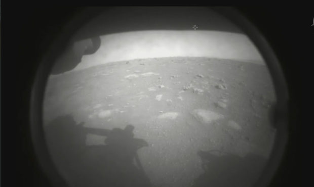 This photo made available by NASA shows the first image sent by the Perseverance rover showing the ...