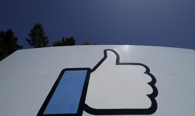 FILE - This April 25, 2019, file photo shows the thumbs-up "Like" logo on a sign at Facebook headqu...