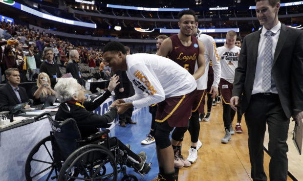 FILE - In this March 15, 2018, file photo, Sister Jean Dolores Schmidt, left, greets the Loyola Chi...