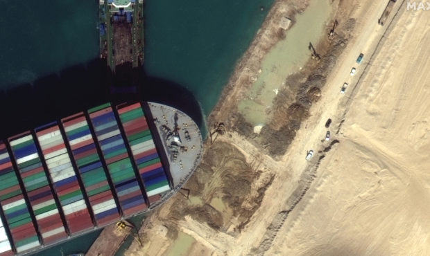 This satellite image from Maxar Technologies shows the cargo ship MV Ever Given stuck in the Suez C...