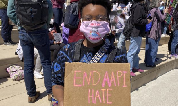 Camden Hunt poses for a picture at a rally on Saturday, March 20, 2021, across from the Georgia sta...