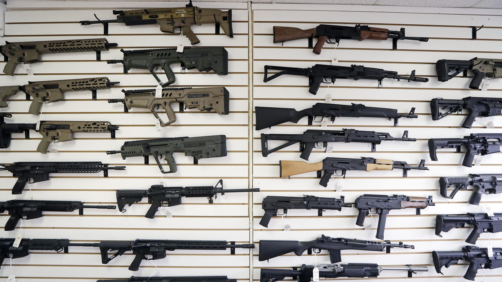 guns on a wall at a gun shop...
