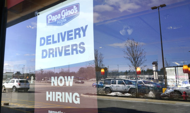 A "Now Hiring" sign is displayed, Thursday, March 4, 2021, in Salem, N.H. After a year of ghostly a...