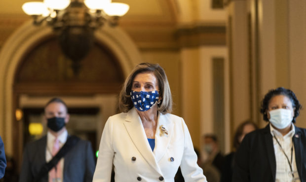 House Speaker Nancy Pelosi of Calif., walks from the House floor, during the vote on the Democrat's...