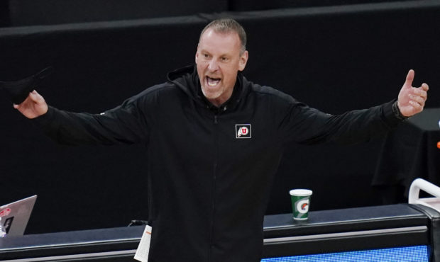 Utah head coach Larry Krystkowiak reacts during the first half of an NCAA college basketball game a...