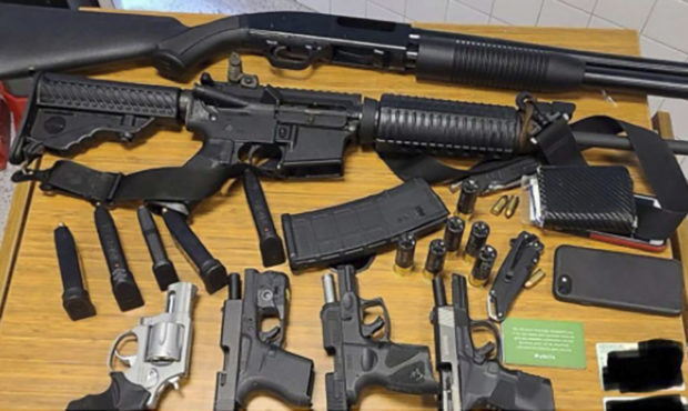This photo provided by the Atlanta Police Department shows weapons Rico Marley was armed with at th...