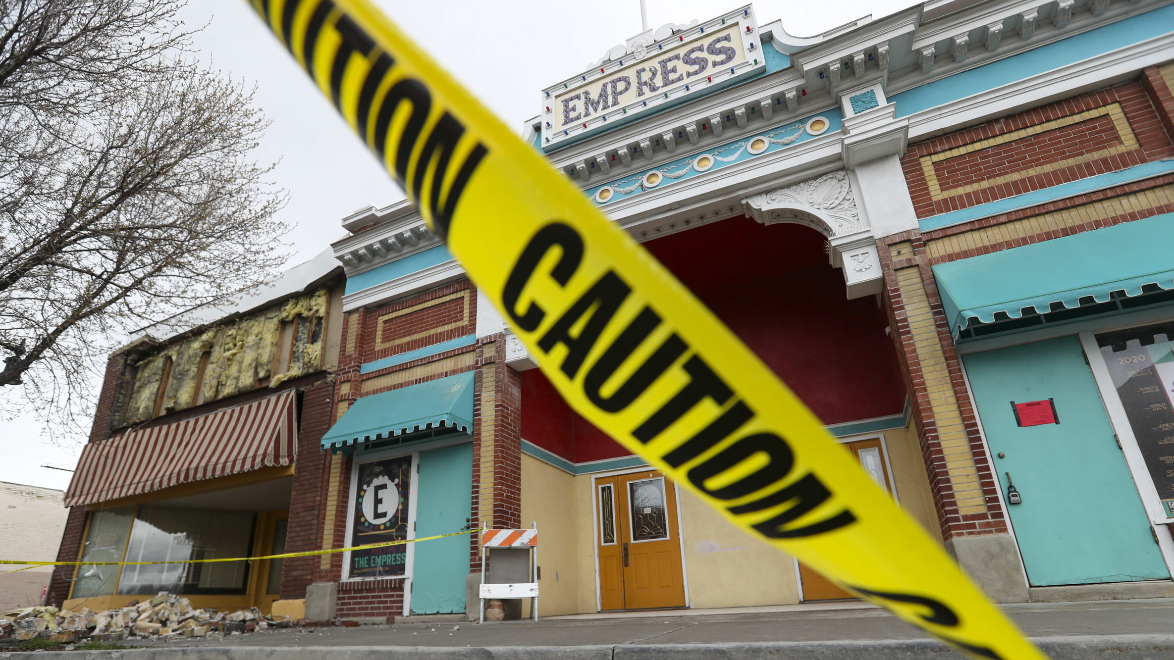 caution tape in front of main street after earthquake,...
