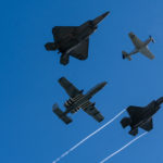 A P-51 Mustang from the Air Force Heritage Flight Foundation flies in formation with U.S. Air Force Maj. Joshua "Cabo" Gunderson, F-22 Demonstration Team commander and pilot, Maj. Cody “ShIV” Wilton, A-10 Demonstration Team commander and pilot, and Capt. Kristin “BEO” Wolfe, F-35A Lightning II Demonstration Team commander and pilot at the 2020 Fort Lauderdale Air Show Nov. 21, 2020, Fort Lauderdale, Fla. The heritage flight is flown at air shows to showcase the past, present, and future Air Force aviation. (U.S. Air Force photo by Capt. Kip Sumner)