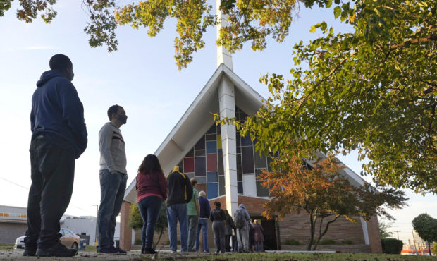 FILE - In this Tuesday, Nov. 3, 2020 file photo, Voters line up outside Vickery Baptist Church wait...