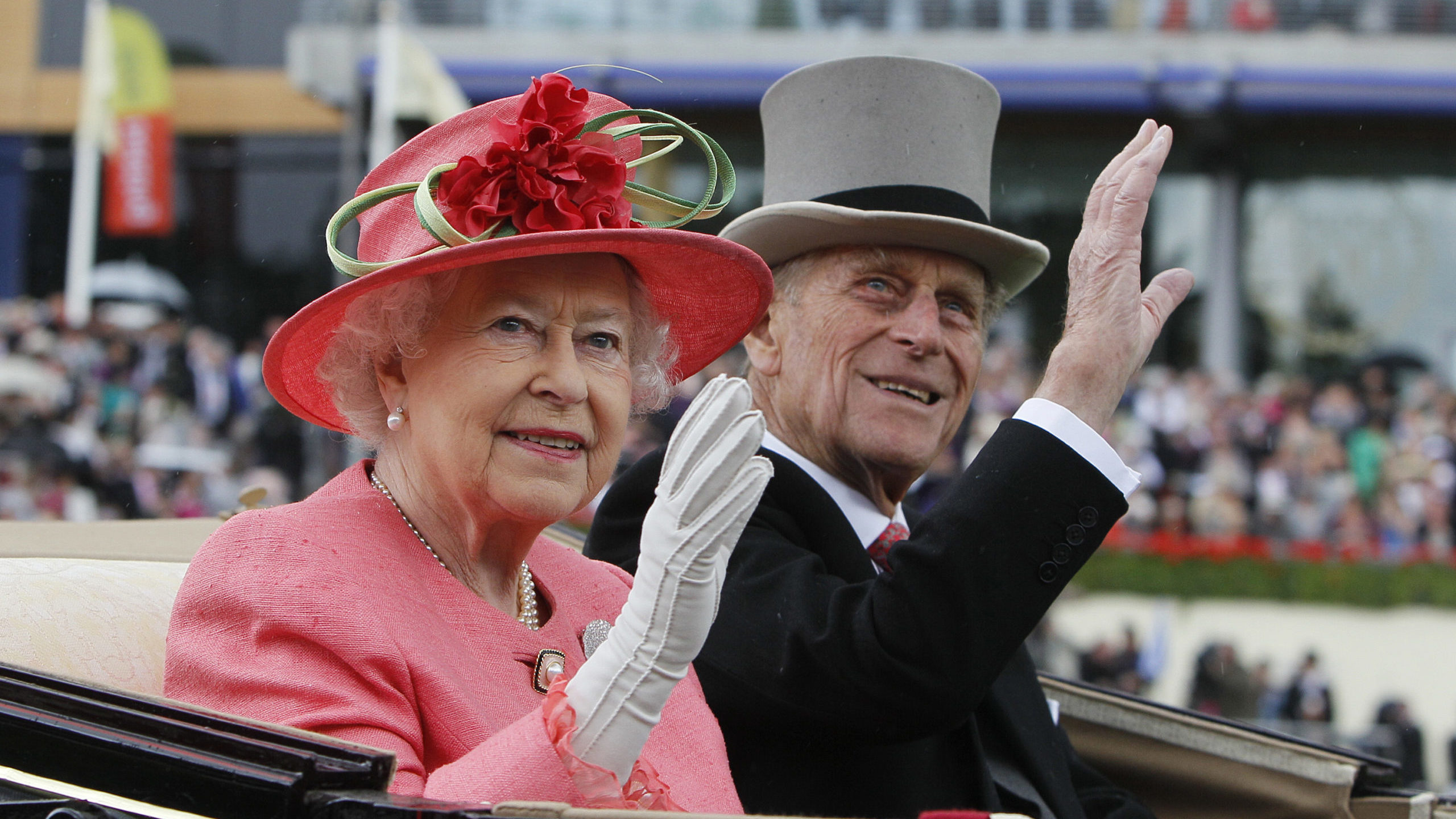 FILE - In this Thursday June, 16, 2011 file photo Britain's Queen Elizabeth II with Prince Philip a...