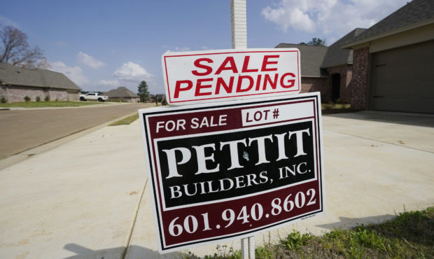 A "Sale Pending" sign stands along side a new driveway in Madison County, Miss., Tuesday, March 16,...