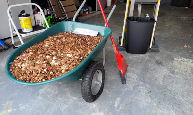 This image provided by Olivia Oxley shows a wheelbarrow filled with pennies, March 20, 2021 in Faye...