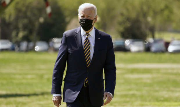 President Joe Biden walks over to speak to members of the media after arriving on the Ellipse on th...