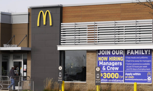 FILE - In this Nov. 19, 2020, file photo, a hiring sign is displayed outside of McDonald's in Buffa...