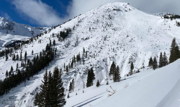 Looking across at the avalanche that caught four skiers on February 1, 2021. Their ski tracks are v...