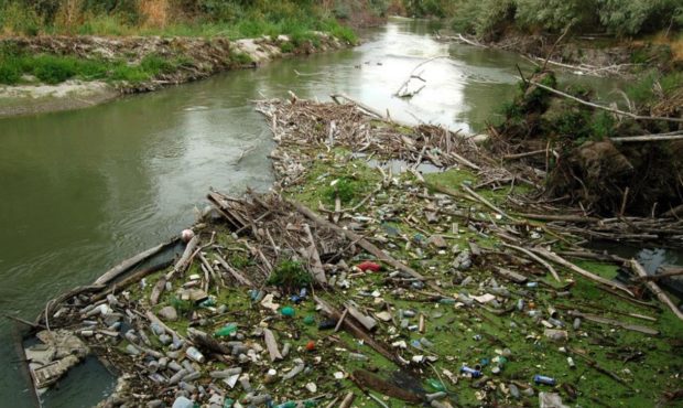 (Debris in the Jordan River. Photo: Tony Frates, courtesy of the Utah Division of Water Quality.)...