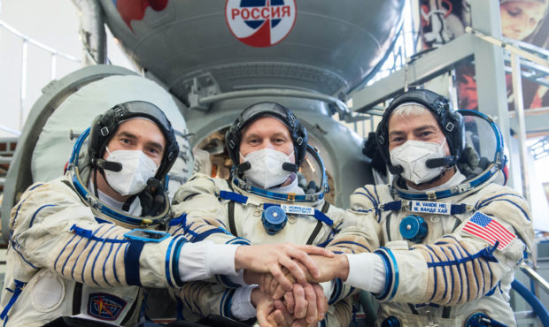 Expedition 65 crew members Russian cosmonaut Pyotr Dubrov of Roscosmos, left, Russian cosmonaut Ole...