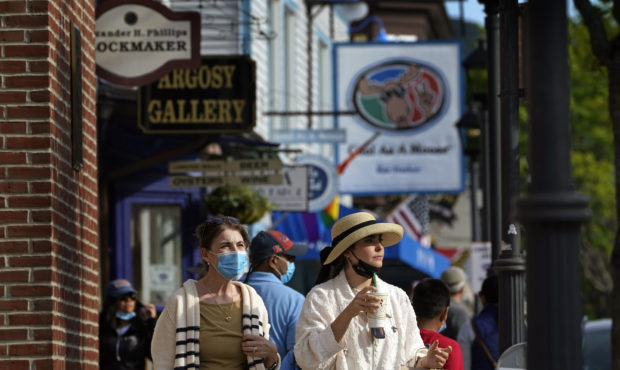 Visitors walk on a busy sidewalk, Saturday, May 15, 2021, in Bar Harbor, Maine. Gov. Janet Mills is...
