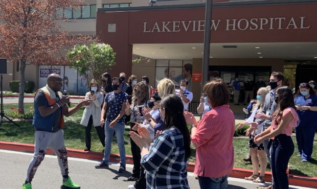 (Alex Boye, left, singing for workers and patients at Lakeview Hospital in Bountiful.  Photo: Paul ...