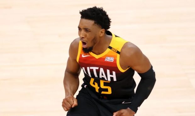 Utah Jazz guard Donovan Mitchell (45) cheers after being fouled on a 3-point attempt as the Utah Ja...