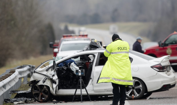 FILE - In this Saturday, Jan. 25, 2020, file photo, emergency crews work the scene of a fatal crash...