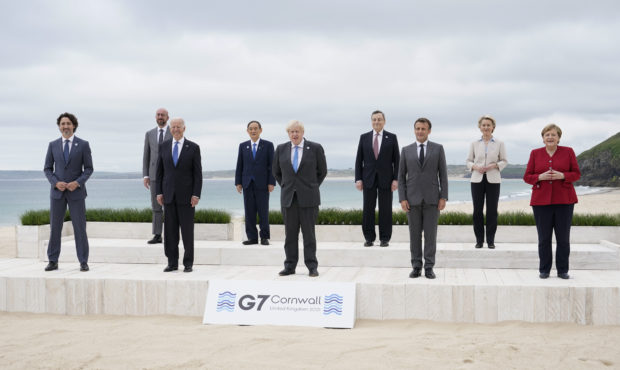 Leaders of the G7 pose for a group photo on overlooking the beach at the Carbis Bay Hotel in Carbis...