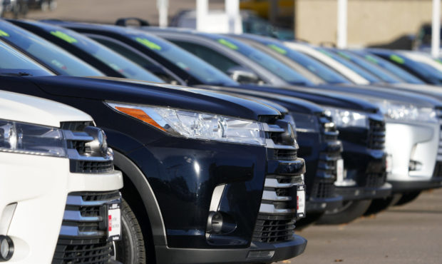 FILE -- This Nov. 15, 2020 photo shows a long row of unsold used Highlander sports-utility vehicles...