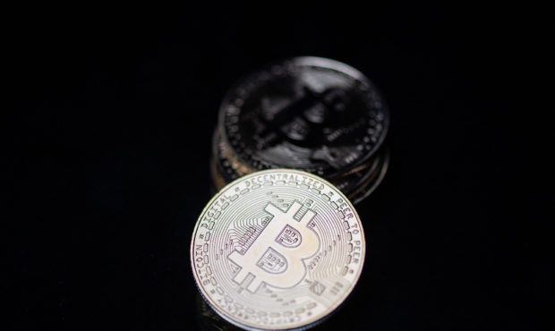 This photograph taken on April 26, 2021 in Paris shows a physical imitation of the Bitcoin crypto c...