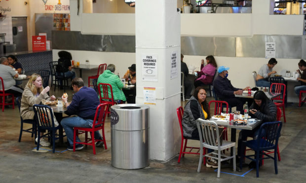 FILE - In this March 17, 2021 file photo Patrons eat lunch in an indoor space at Grand Central Mark...