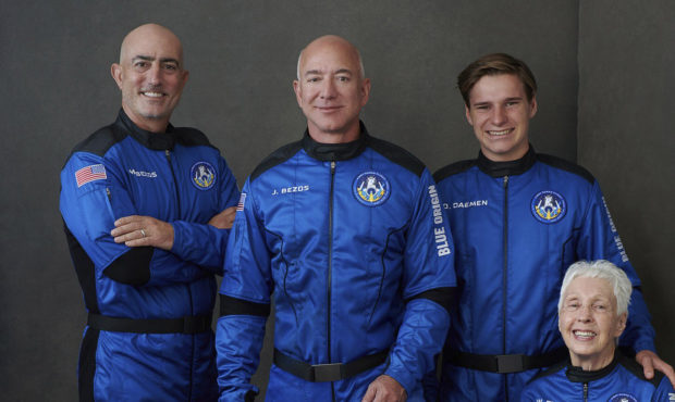 In this photo provided by Blue Origin, from left to right: Mark Bezos, brother of Jeff Bezos;Jeff ...