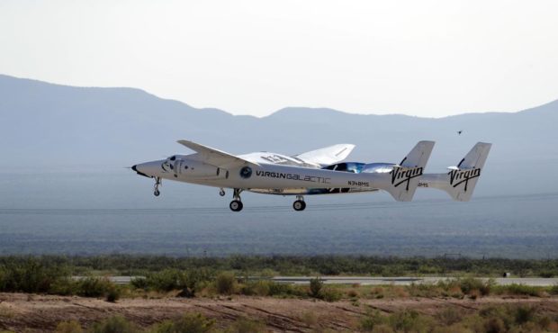 The rocket plane carrying Virgin Galactic founder Richard Branson and other crew members takes off ...