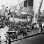 FILE - In this April 23, 1975 photo provided by the Department of Defense, Vietnamese refugees crowd aboard the Military Sealift Command ship Pioneer Contender to be evacuated to areas further south. (Department of Defense via AP, File)