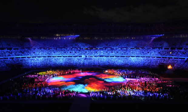 Athletes arrive during the closing ceremony in the Olympic Stadium at the 2020 Summer Olympics, Sun...